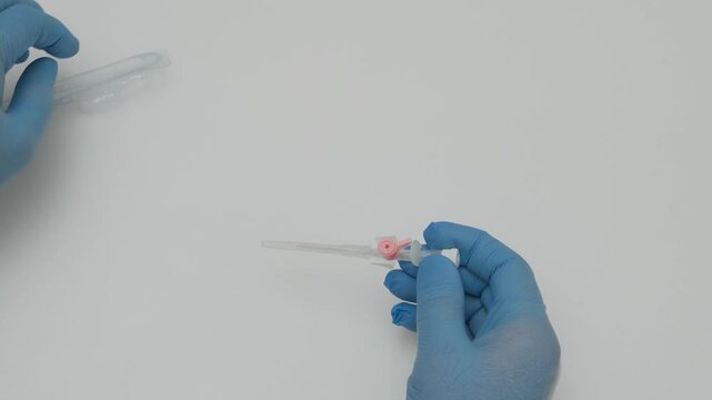 hands taken out of the package medical cannula slow motion
