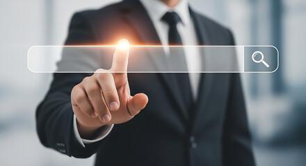 A man in a suit touching a search bar with a magnifying glass icon in a blurred background image scene
