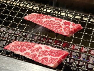 raw beef meat on BBQ grill