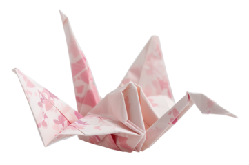 This decorative paper crane features a delicate floral pattern in soft pink tones, showcasing the beauty of origami art