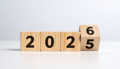 Wooden blocks flipping from 2025 to 2026.
