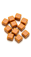 Fototapeta premium Pile of Unwrapped Caramel Candy Isolated Sweet Treat Dessert