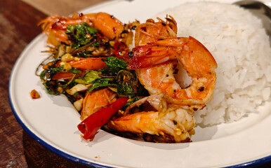 Stir-fried fresh shrimp with basil in a plate