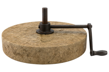 Old stone hand mill with a metal crank for grinding grain isolated on a transparent background