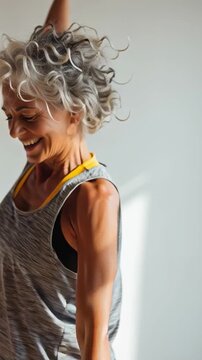 Joyful Movement: A vibrant senior gracefully moves, bathed in sunlight. Embracing a life of fitness and self-love.