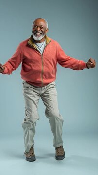 Joyful Senior Dance: A lively senior man with a warm smile joyfully dances, embracing life with open arms, a symbol of freedom, and vitality.
