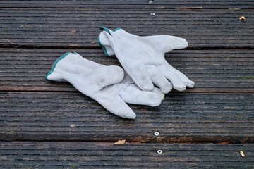 Work gloves on wooden slats