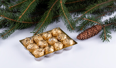 box of chocolates pralines (candies) with christmas decoration