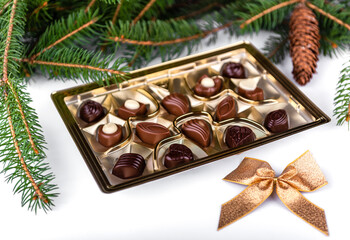 box of chocolates pralines (candies) with christmas decoration