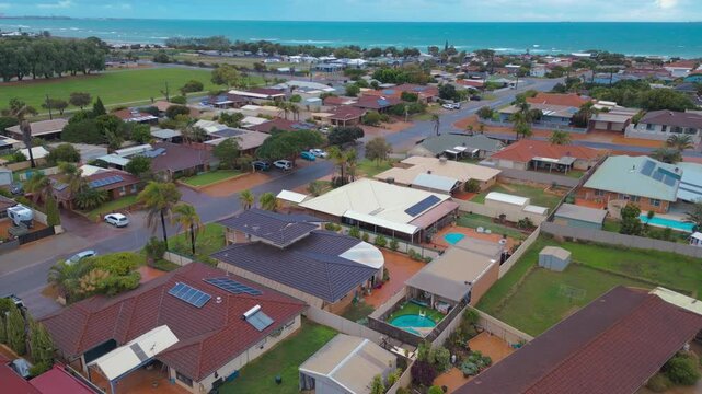 Drone footage of residential buildings next to Sunset Beach in Geraldton, Perth in Western Australia