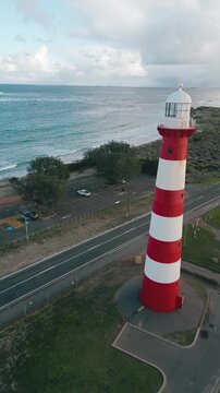 Cinematic aerial footage showing a slow pan of the Point Moore Lighthouse in Geraldton, Perth