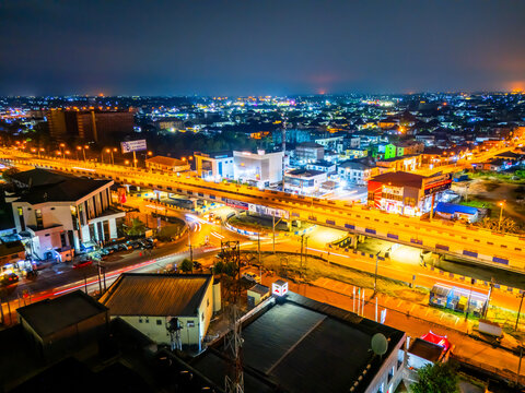 Aerial view of vibrant city lights paint a mesmerizing canvas over GRA Junction and Aba Road, creating a stunning contrast against the night sky, Port Harcourt, Rivers State, Nigeria.