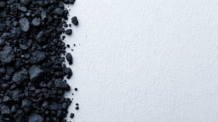 Close-up of black coal fragments in factory industrial standards on clean surface