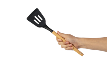 Hand holding kitchen utensils on transparent background