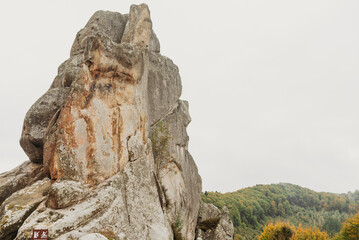 Rocky cliffs and green mountain landscape in the Ukrainian Carpathians — natural sandstone formations and forest view