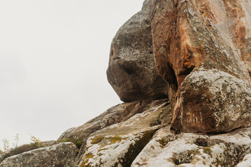 Rocky cliffs and green mountain landscape in the Ukrainian Carpathians — natural sandstone formations and forest view