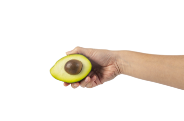 whole and half avocado and hand isolated on transparent background close-up.