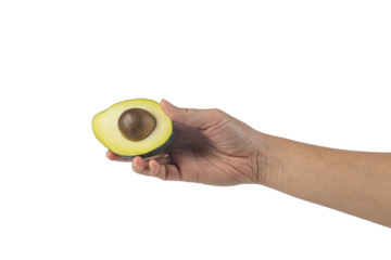 whole and half avocado and hand isolated on transparent background close-up.