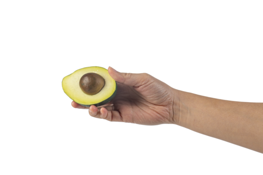 whole and half avocado and hand isolated on transparent background close-up.