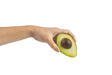 whole and half avocado and hand isolated on transparent background close-up.