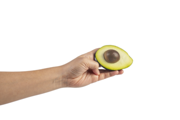 whole and half avocado and hand isolated on transparent background close-up.
