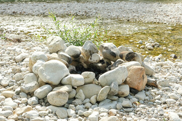 River Stones Stacked Like a Campfire Circle