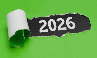 Hole in white paper with torns edges - 2026
