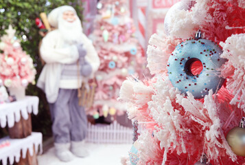 Closeup of Ornament on Snow Covered Christmas Tree in Gorgeous Pastel Tone