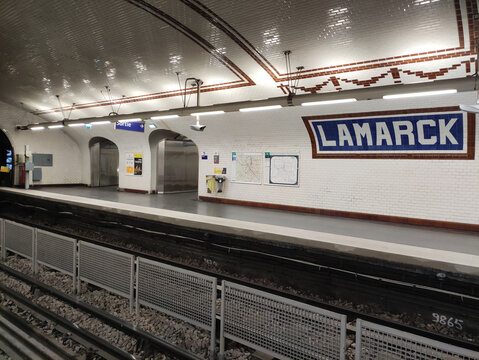 Paris, France - November 22, 2025: Lamarck Metro Station interior in Paris, showcasing tiled walls, platform details, and signage, capturing the essence of urban transportation