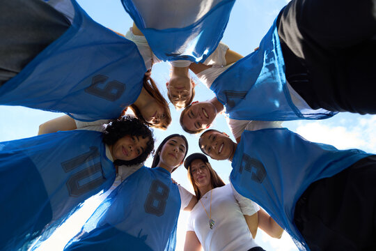 Diverse women soccer team huddling for motivation