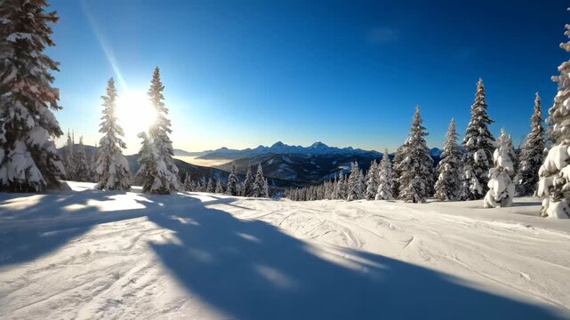 POV of skiing down a snowy mountain trail on a sunny winter day. Empty ski slope with snow-covered trees and a distant mountain range. Winter sports and adventure travel