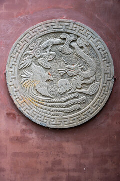 Craftsmanship showcased in a detailed stone carving in Chengdu