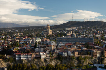Tbilisi Holy Trinity Sameba Cathedral And Cityscape On Cliff At Golden Hour