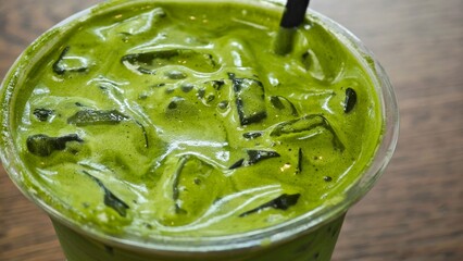 Iced matcha latte. Close up.