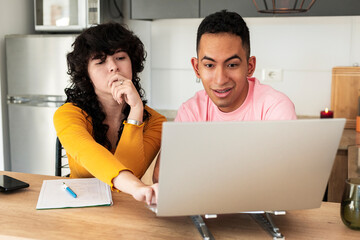 Engaged friends exploring ideas together in creative lifestyle