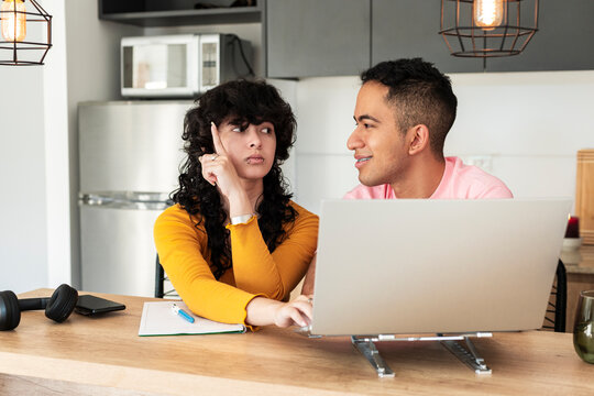 Inspired friends sharing sudden idea during study session