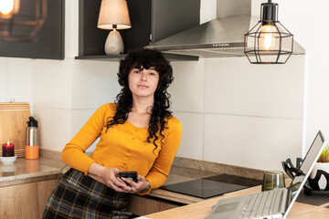 Creative young woman holding smartphone in expressive urban lifestyle