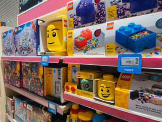 Obraz premium Dnipro, Ukraine 11.13.2025: Various LEGO brand building sets and boxed kits displayed on shelves in a toy store. Highlights the popular construction toy brand and retail presence