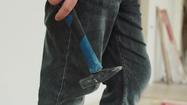 Man Holding a Hammer in Hand