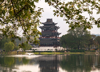 Traditional Chinese Pagoda Reflected in a Calm Lakeside Park