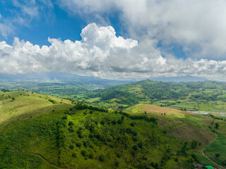 Obraz premium Aerial view of rice plantations and farmland of farmers in a mountain valley. Negros, Philippines