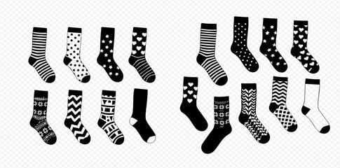 Collection of black and white socks with various patterns like stripes, polka dots, hearts, and geometric designs.