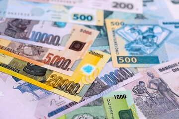 Congolese franc money bills in big amount on table close up. Rich life concept in Democratic Republic of Congo. Business and economy
