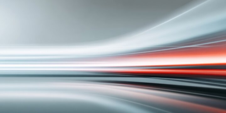 Streaks of white and red light flow across a futuristic gray background in abstract motion. - Powered by Adobe