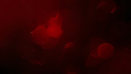 Glowing red bokeh cluster creating moody low-light studio abstraction, with soft light flares