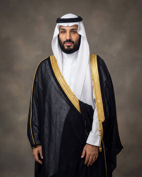 Studio portrait of a Middle Eastern leader wearing traditional Saudi attire, captured with elegant lighting and a formal pose. The image reflects authority, culture, and modern regional identity