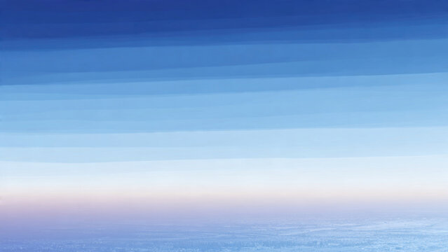 Watercolor-like sky gradient showcasing varying shades of blue, fading into a light horizon with a blurred, distant cityscape below.