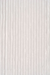 A close-up, full-frame background image of a uniform light gray or white surface featuring subtle vertical embossed or ribbed lines