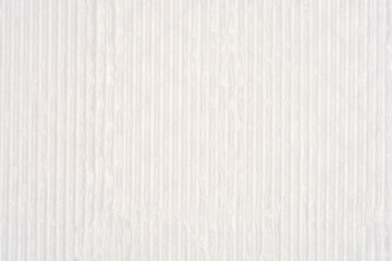 A close-up, full-frame background image of a uniform light gray or white surface featuring subtle vertical embossed or ribbed lines