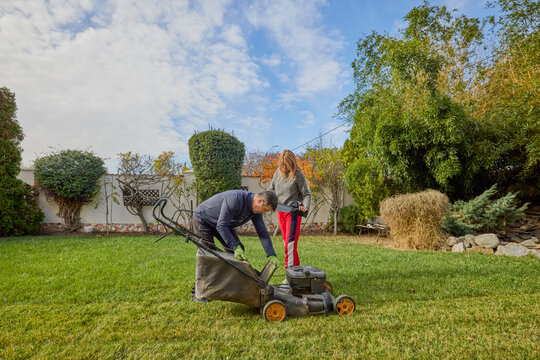 A middle-aged man and his wife work in the garden and do various maintenance activities. - Powered by Adobe